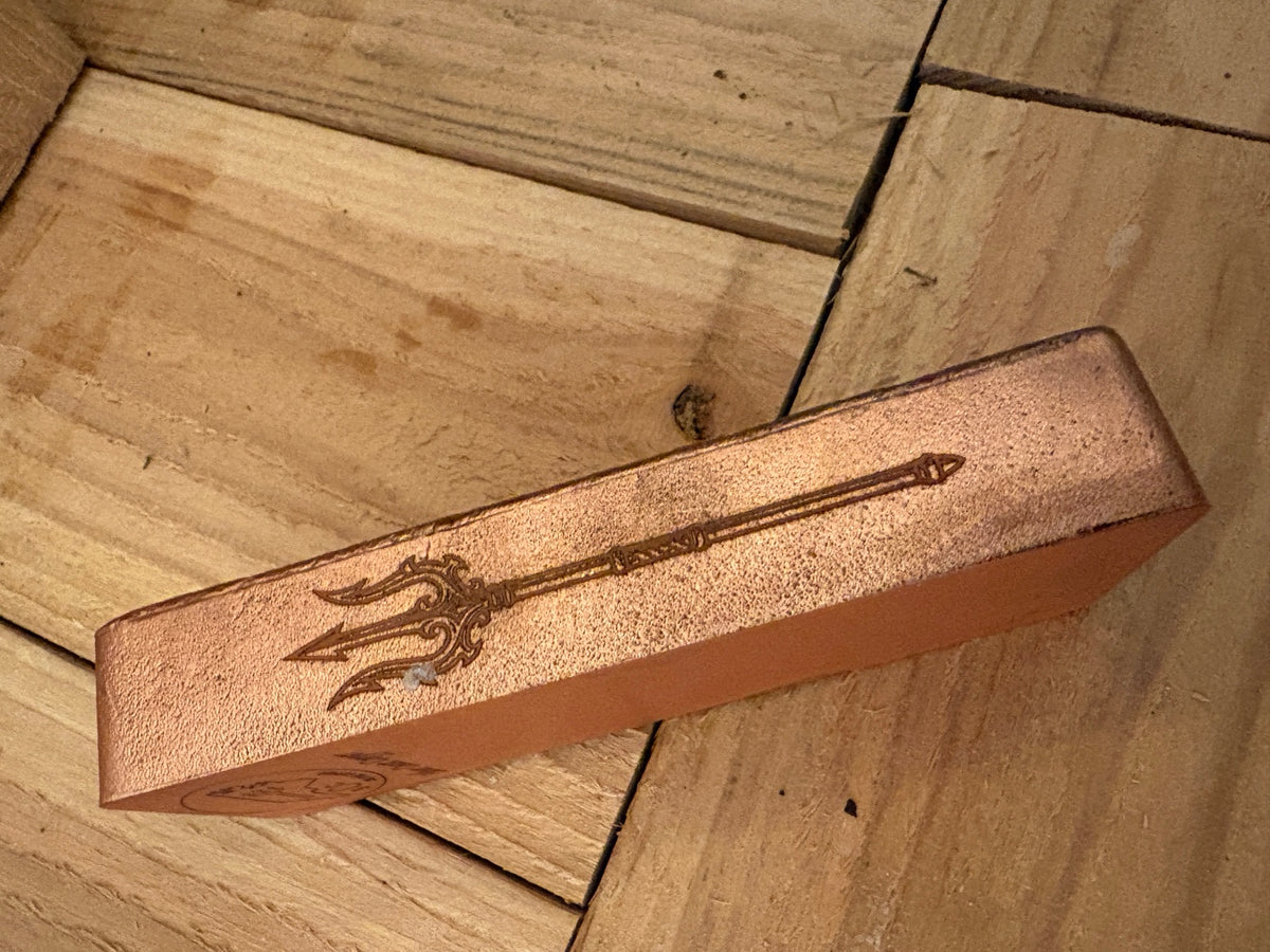 Trident edge engraving on 2 kilogram copper bar