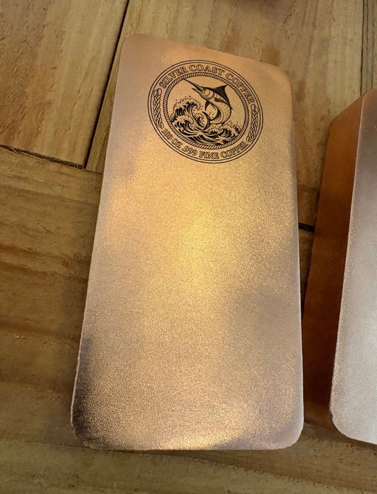 100 oz .999 fine copper Marlin bar with satin finish on cedar boards
