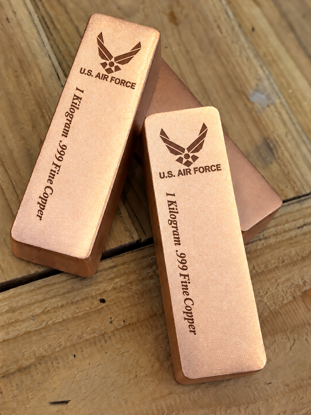 1 kilogram .999 fine copper Air Force bar in satin finish, angled stacked view, top emblem and lengthwise inscription