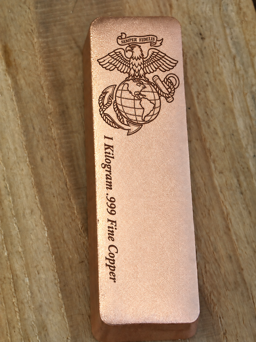 1 kilogram .999 fine copper Marine Corps bar in satin finish, front view, top emblem and lengthwise inscription
