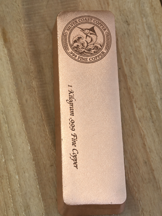 1 kilogram satin copper bar with Silver Coast Copper marlin logo and .999 fine copper weight inscription