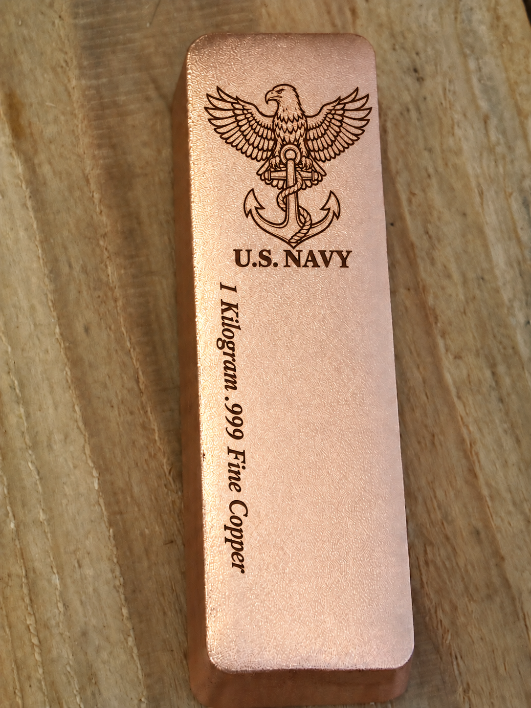 1 kilogram .999 fine copper Navy bar in satin finish, front view, top emblem and lengthwise inscription