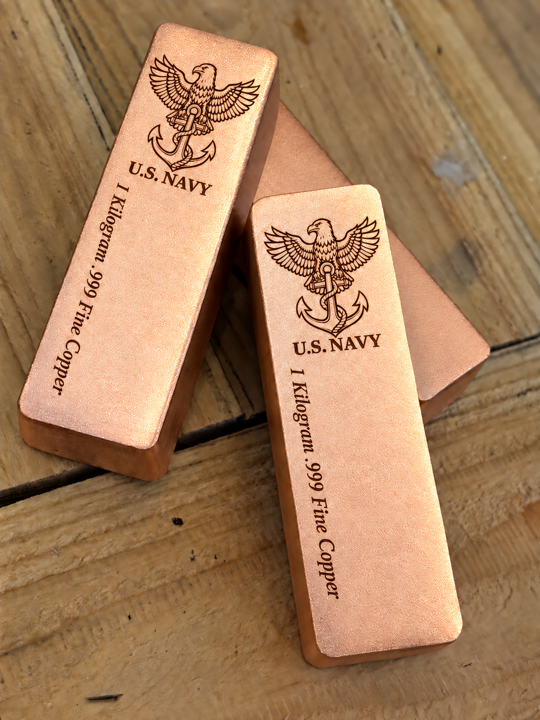 1 kilogram .999 fine copper Navy bar in satin finish, angled stacked view, top emblem and lengthwise inscription