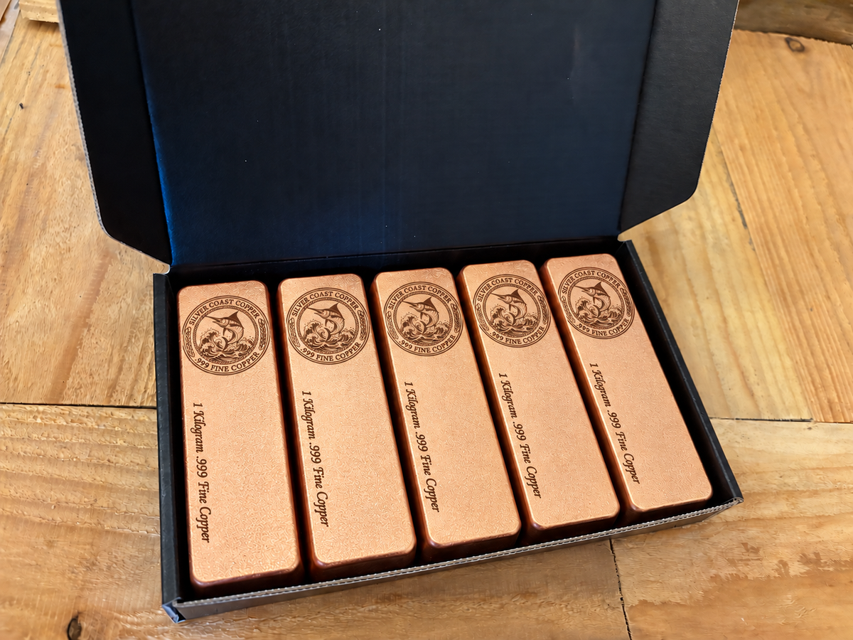 Marlin Logo five-pack: five 1 kilogram .999 fine copper bars in satin finish, displayed in an open black presentation box