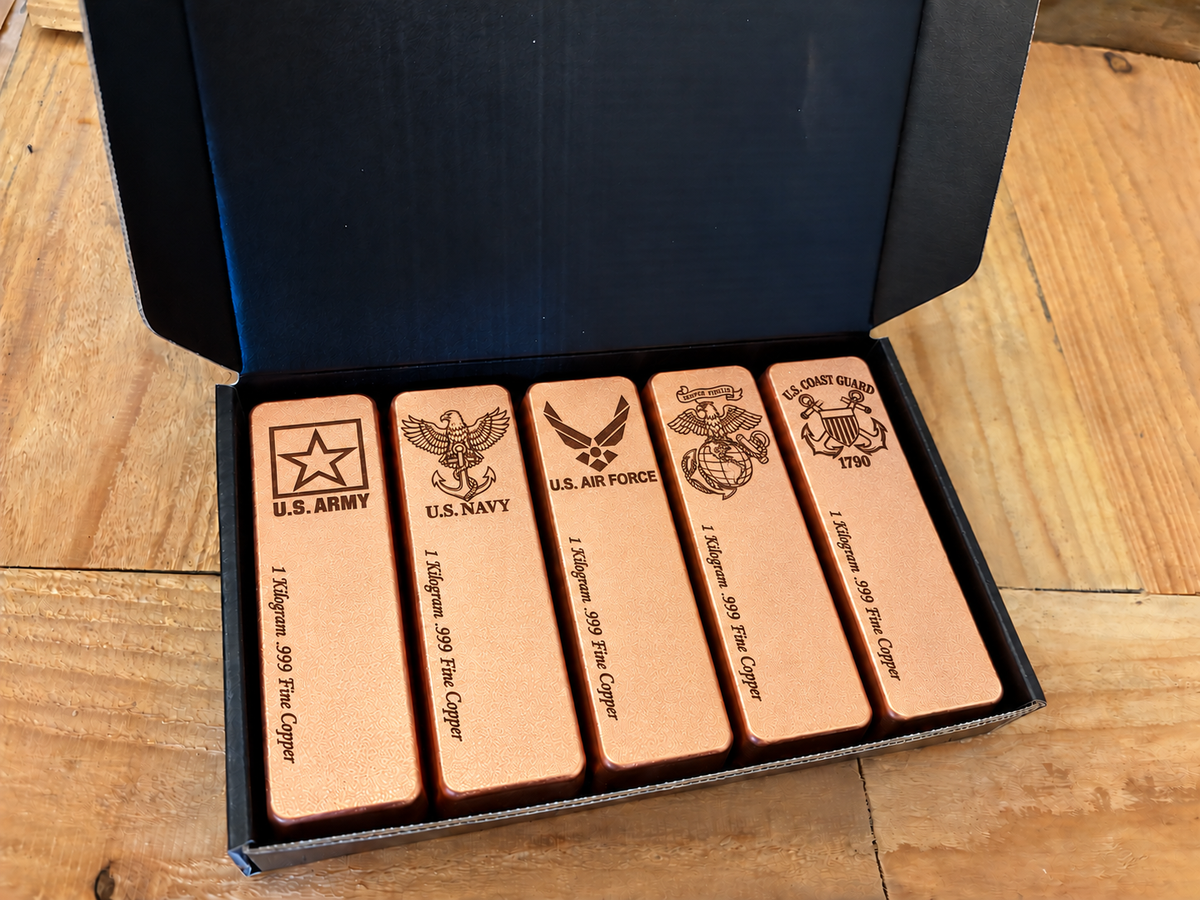Mixed Armed Forces five-pack: five 1 kilogram .999 fine copper bars in satin finish, displayed in an open black presentation box