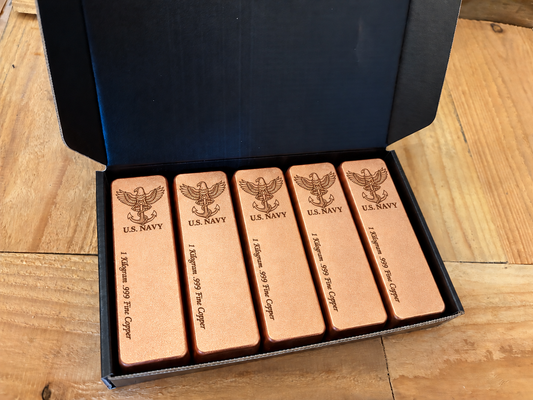 Navy five-pack: five 1 kilogram .999 fine copper bars in satin finish, displayed in an open black presentation box