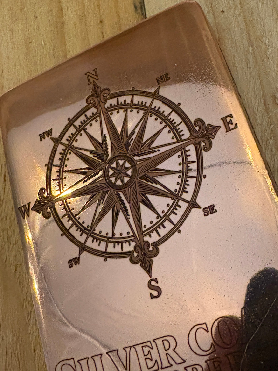 Compass Rose engraving detail on 1 kilogram copper prototype