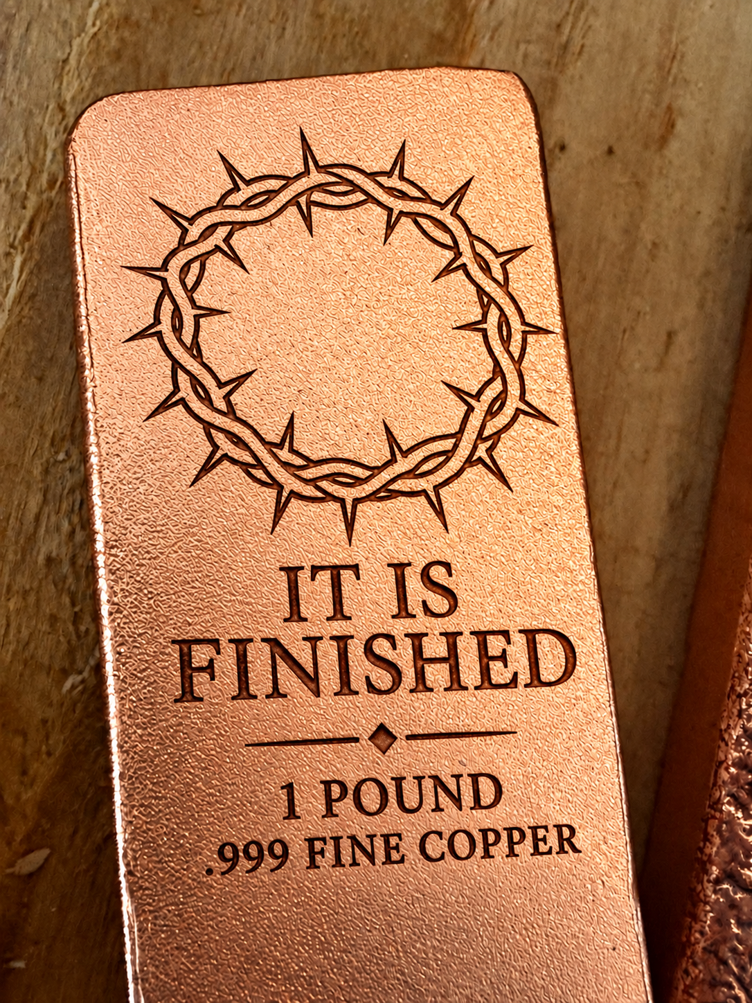 Crown of Thorns and "It Is Finished" engraved on a 1 pound .999 fine copper satin bar, close-up view (design preview)