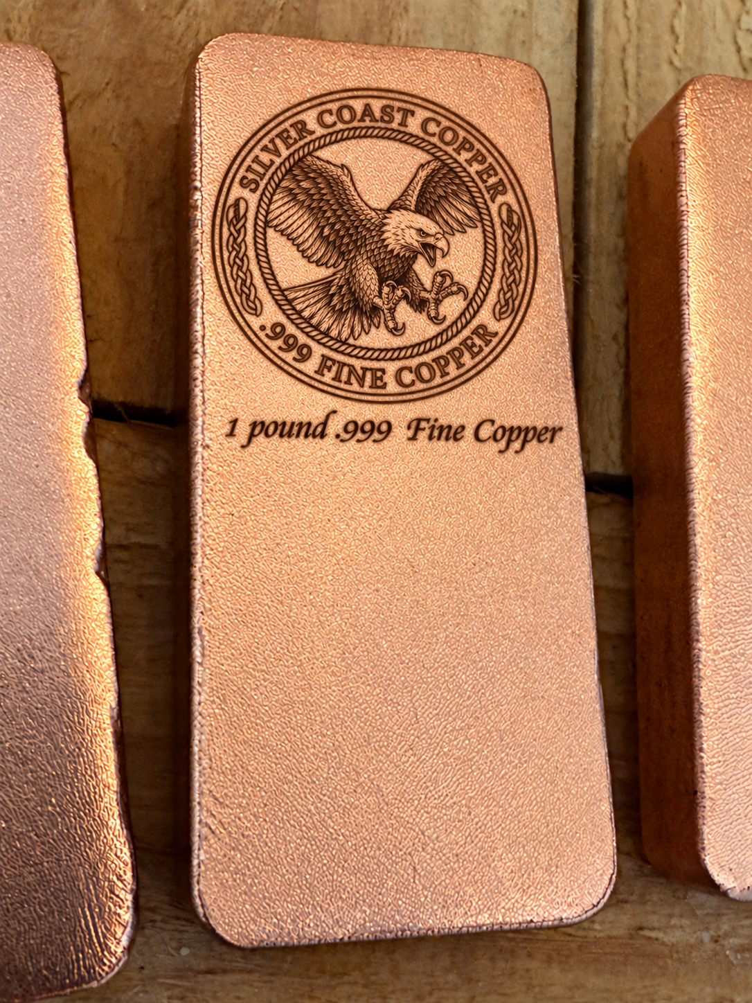 One pound .999 fine copper bar engraved with Silver Coast Copper eagle logo, front view