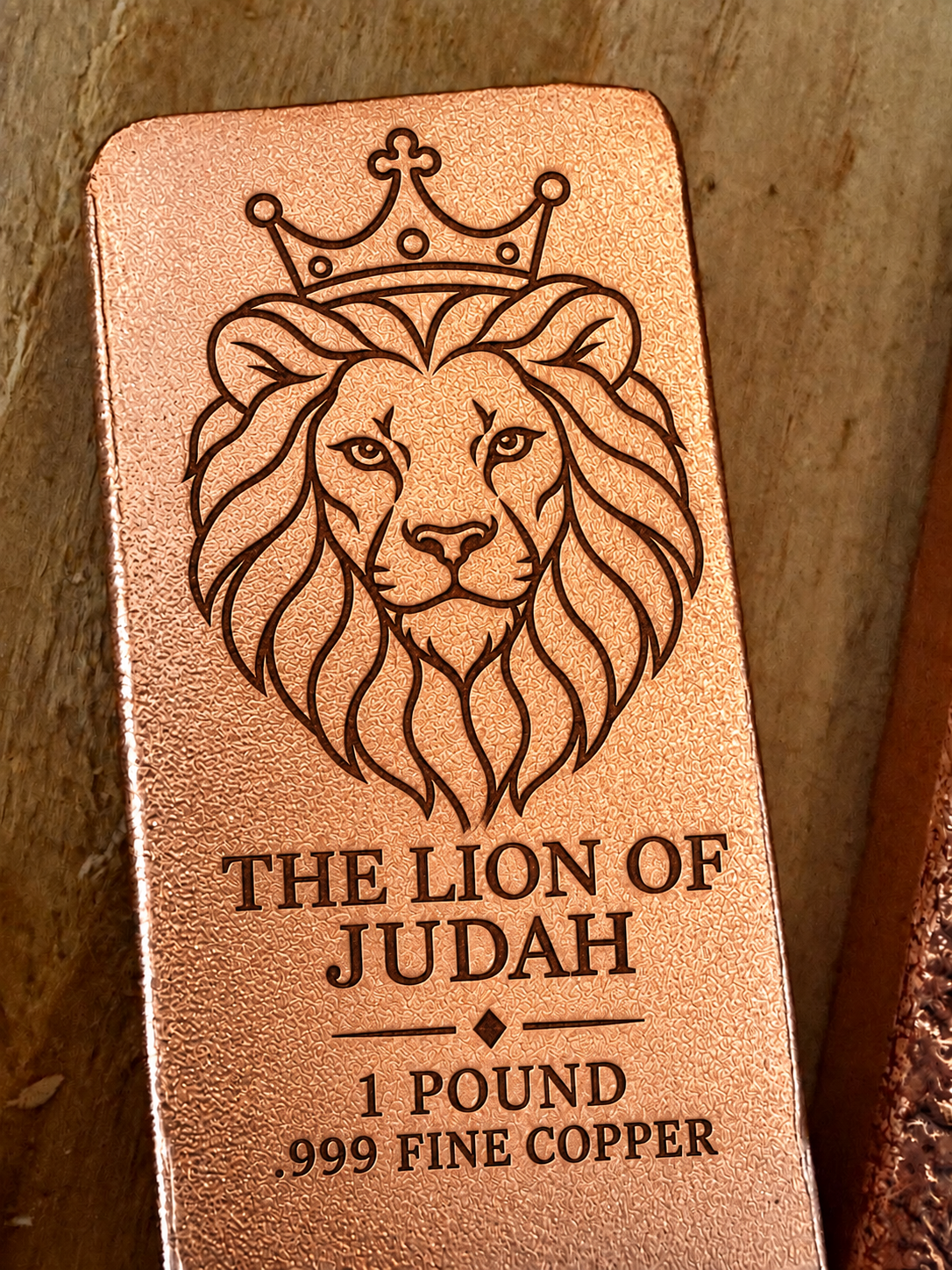 Lion of Judah and "The Lion of Judah" engraved on a 1 pound .999 fine copper satin bar, close-up view (design preview)