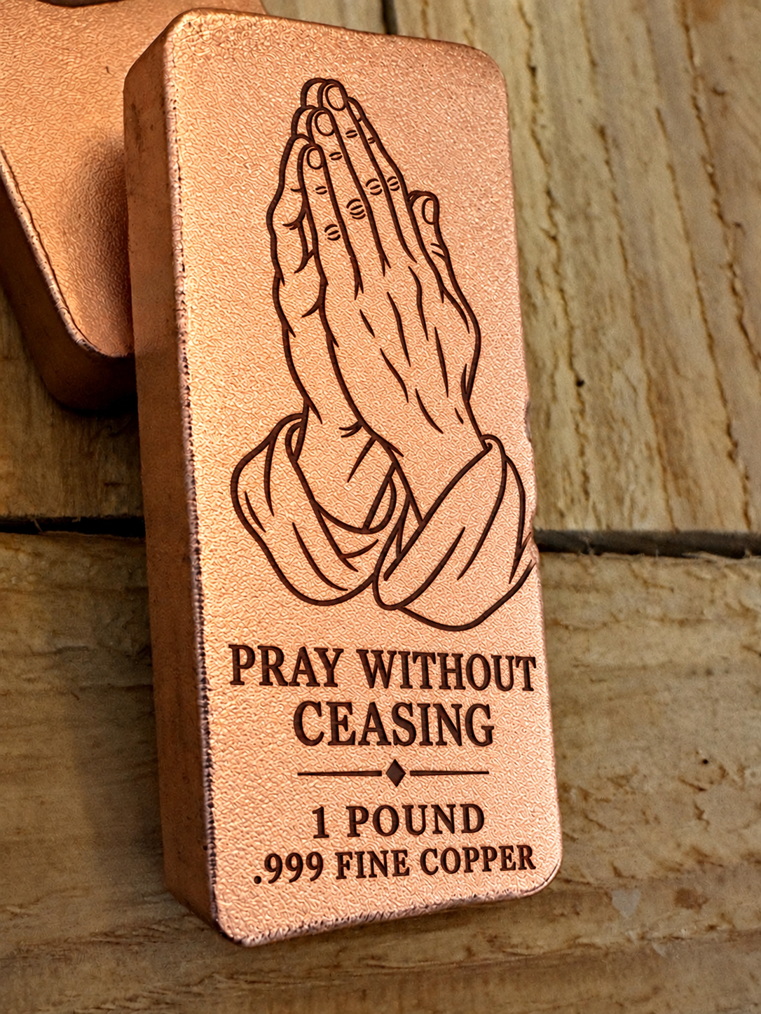 Praying Hands and "Pray Without Ceasing" engraved on a 1 pound .999 fine copper satin bar, angled view (design preview)