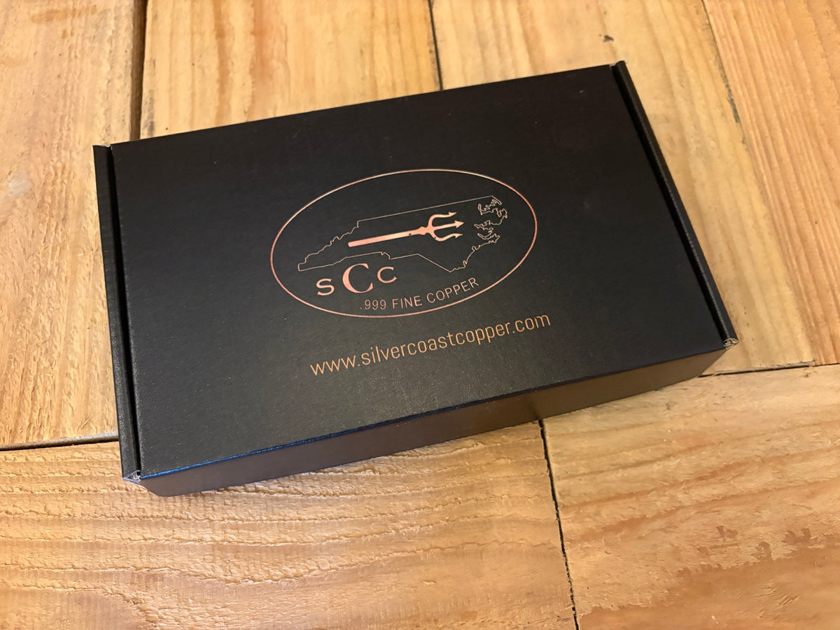 Closed Silver Coast Copper presentation box with copper-colored logo